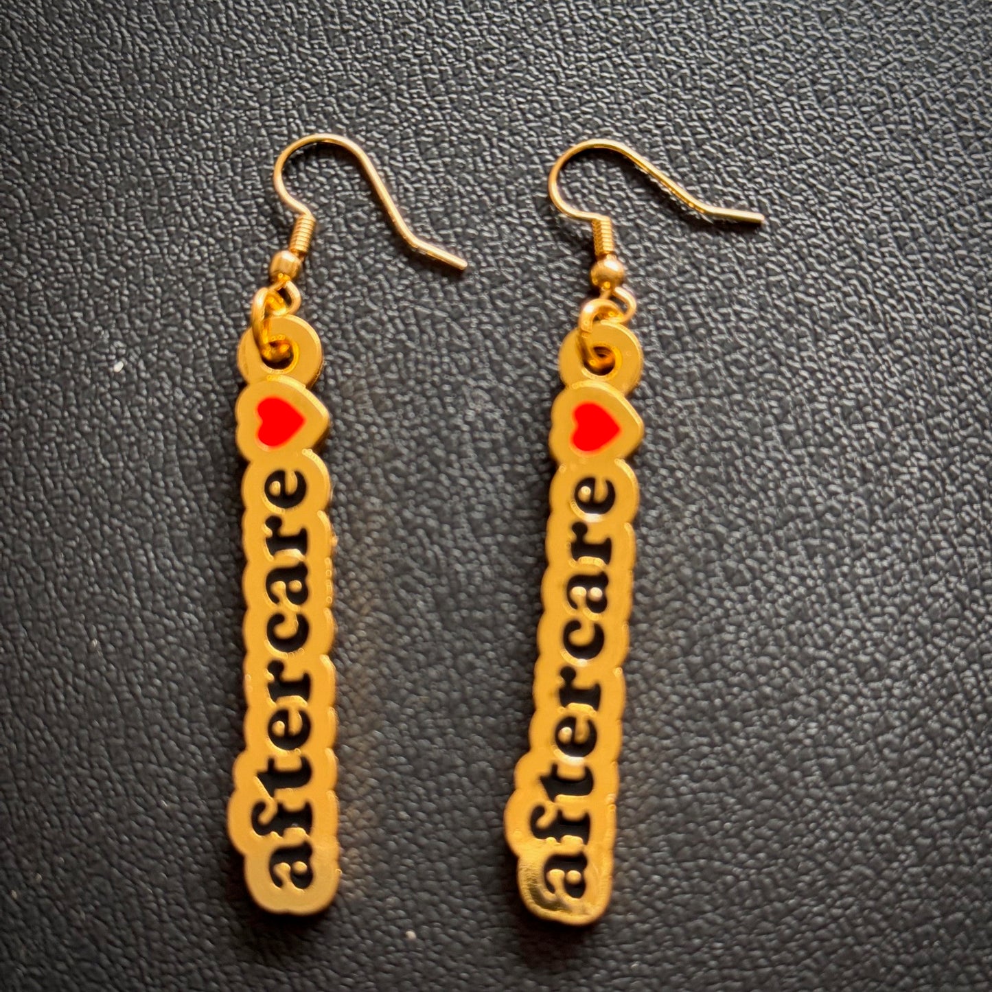 "I love aftercare" earrings