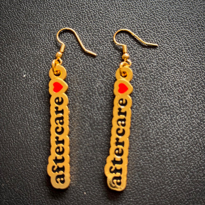 "I love aftercare" earrings